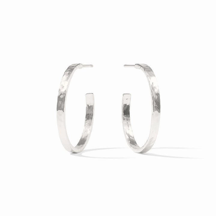 Pair of silver hoop earrings on a white background