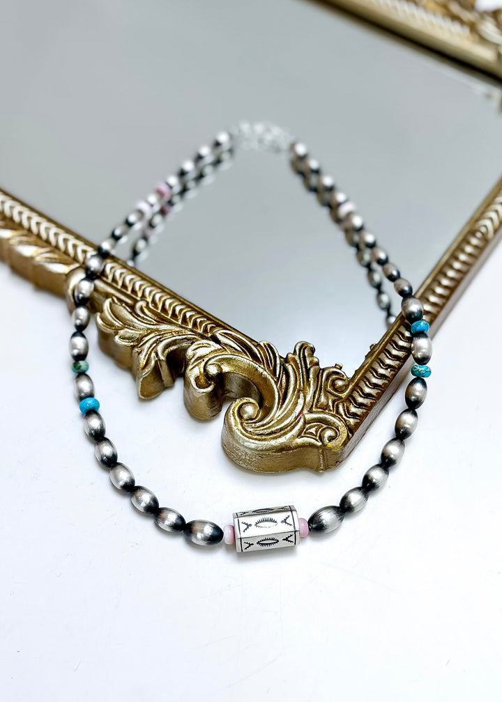 Navajo pearl necklace with turquoise and pink conch beads and stamped barrel bead, 17 inch sterling silver necklace