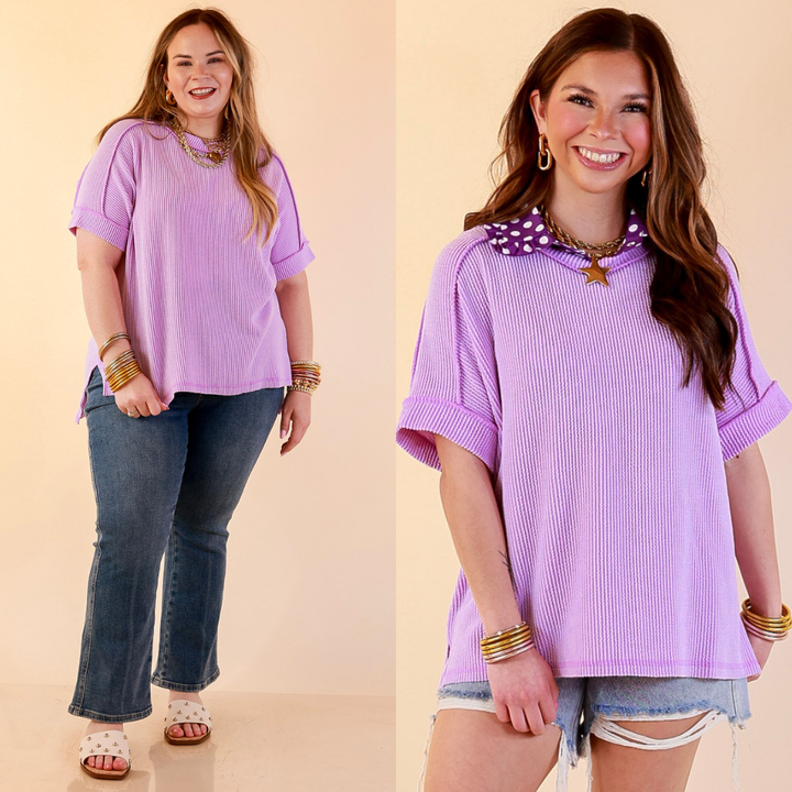 Models are wearing Daily Perfection Scoop Neck Short Sleeve Ribbed Top in Lavender Purple with bottoms against a beige backdrop.