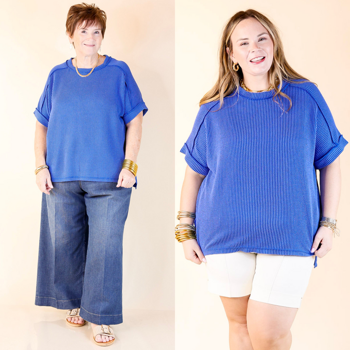 Designed with a flattering scoop-neck, ribbed texture, and short sleeves, this versatile tee is perfect for any occasion. Sizes S/M through 2X/3X.