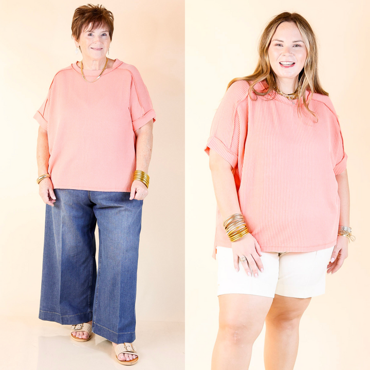 Designed with a flattering scoop-neck, ribbed texture, and short sleeves, this versatile tee is perfect for any occasion. Sizes S/M through 2X/3X.