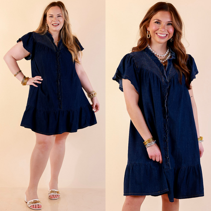Models are wearing Smocked Yoke Dress with Ruffle Front and Flutter Sleeves in Dark wash against a beige backdrop. 