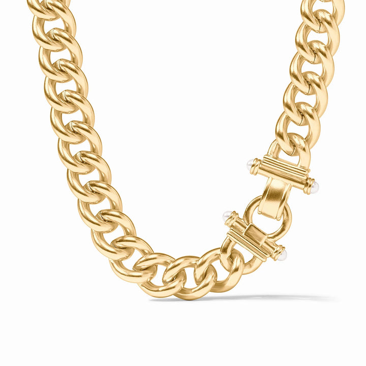 Gold chain necklace with a clasp on a white background