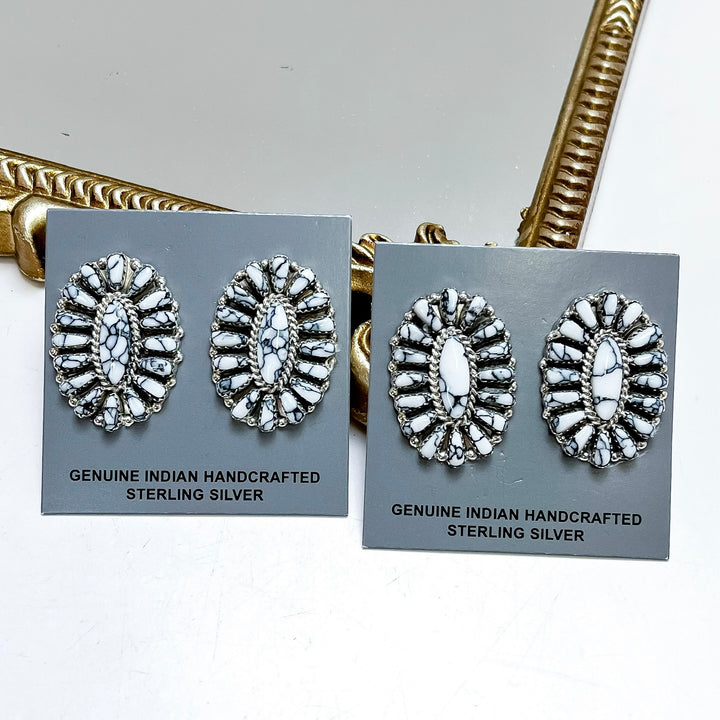 Sterling silver white buffalo cluster stud earrings handmade by Native American artist Juliana Benally with black matrix detailing and southwestern styling.