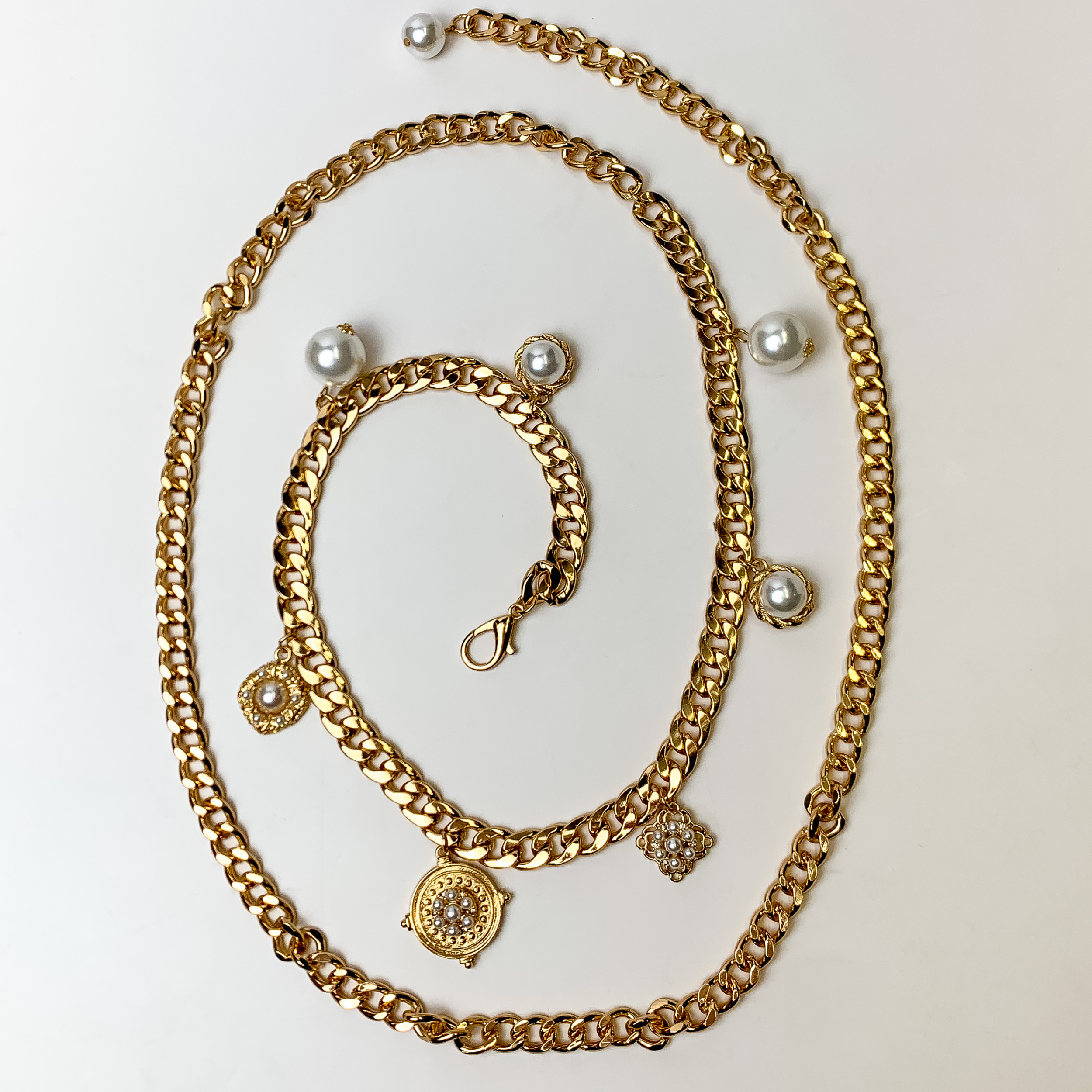 This Eccentric Gold Tone Belt with Pearls and Pendants is pictured on a white background.