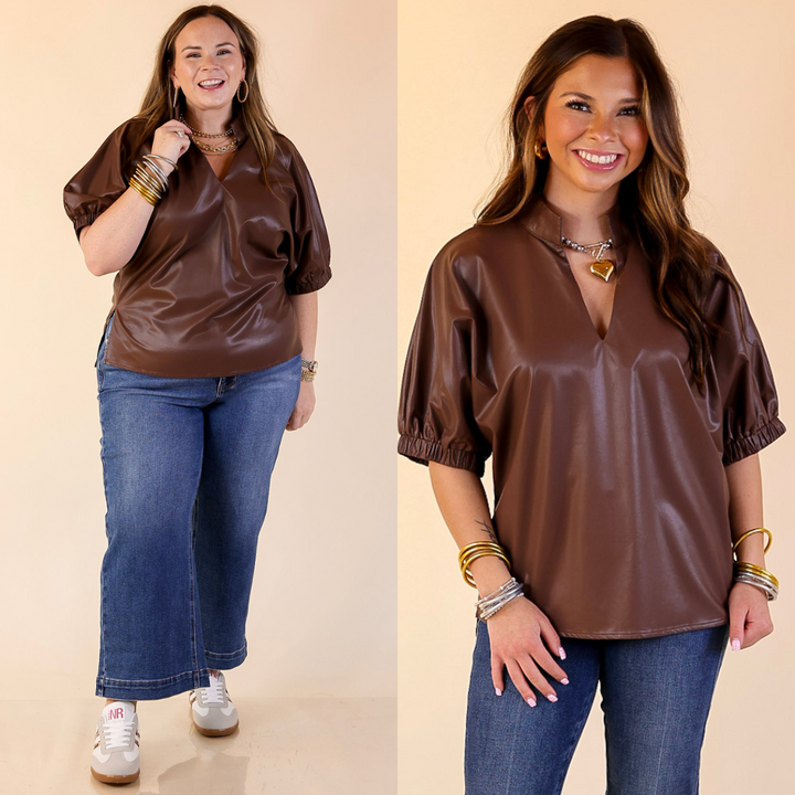 Two women wearing chocolate brown faux leather balloon sleeve tops and blue jeans on a beige background