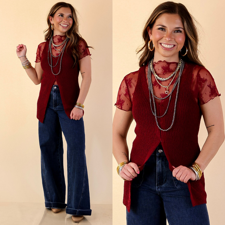 Model is wearing Textured Knit Front Clasp Sweater Vest in Maroon with jeans against a beige backdrop.