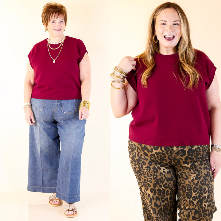 Two women wearing red tops and pants on a plain background