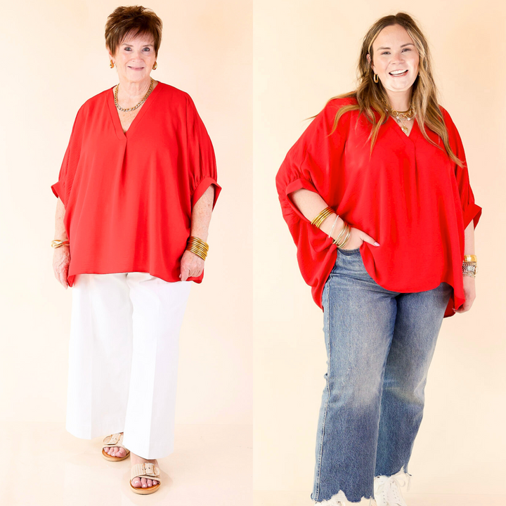 Designed with a V-neckline and slightly puffed half sleeves. Available in S/M through 2X/3X.