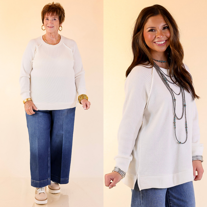 Two women wearing white long-sleeve shirts and blue jeans on a beige background