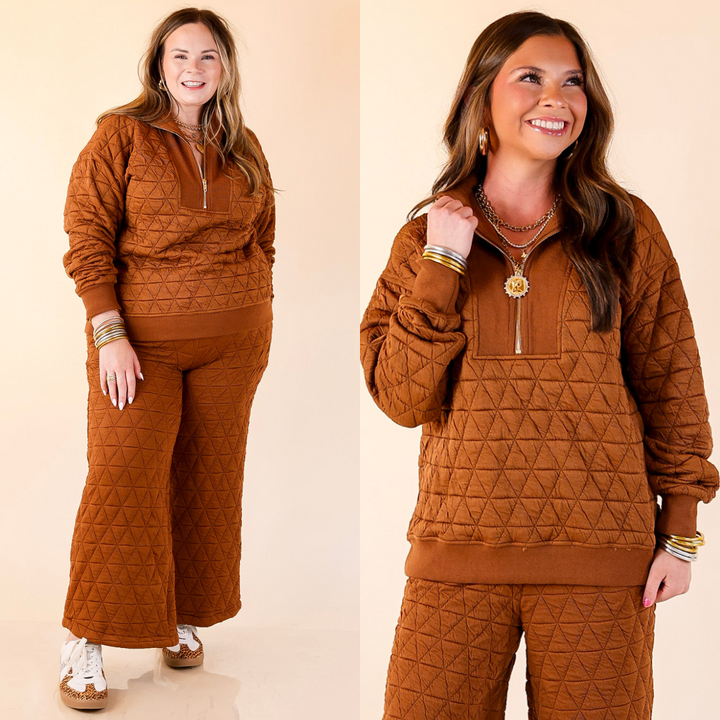 Two women wearing matching brown quilted outfits on a beige background