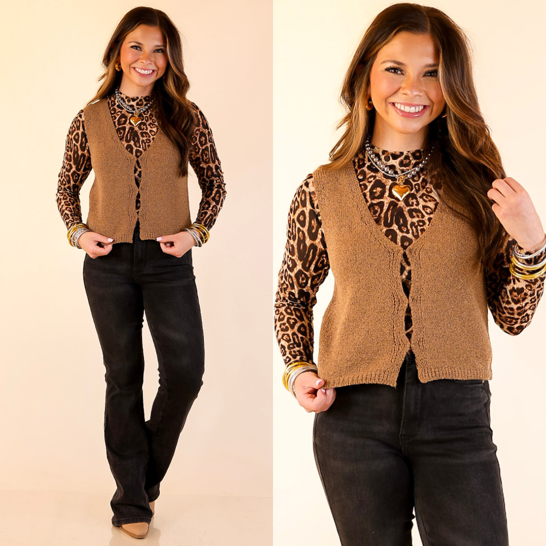 Woman wearing a leopard print long-sleeve mesh top, camel brown vest, and black jeans on a beige background