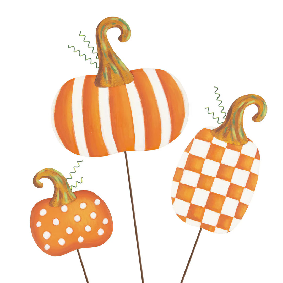Three Round Top Collection orange and white patterned pumpkin garden stakes in striped, checkerboard and polka dot designs with whimsical curled stems.