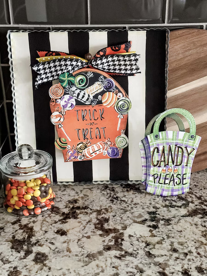 The Round Top Collection Trick or Treat Bag Charm featuring colorful Halloween candy and glitter accents for display boards, wreaths, and Halloween decorating.