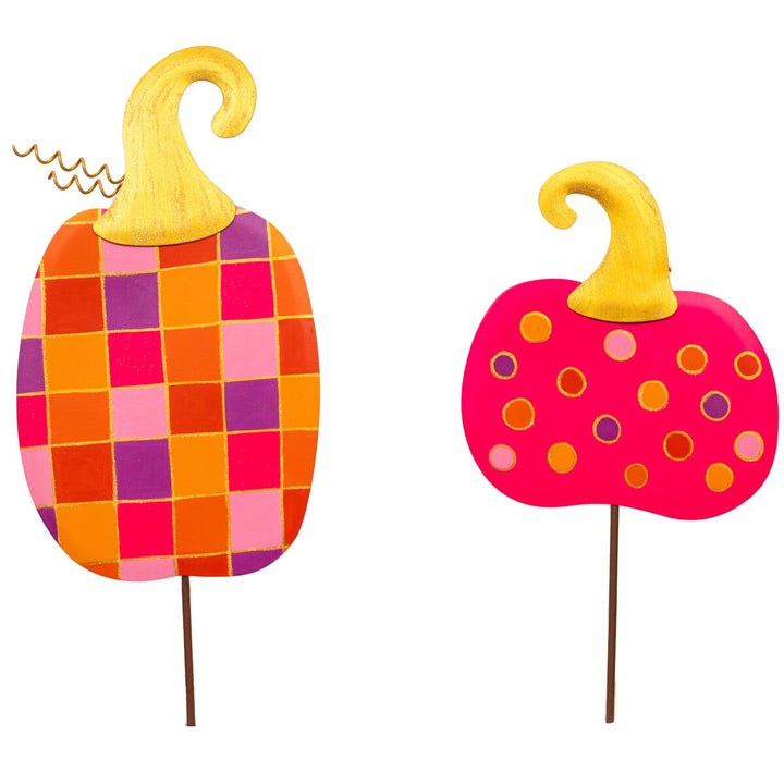 Bright checkerboard and polka dot pumpkin metal décor by The Round Top Collection in pink, orange, and lavender with gold glitter accents for colorful Halloween decorating.