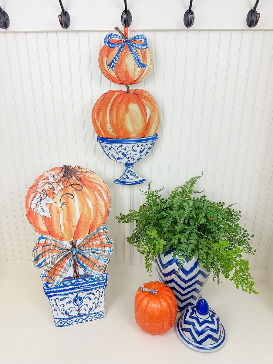 Rosanne Beck Blue Pumpkin Topiary by The Round Top Collection displayed with coordinating blue and white fall décor, greenery and orange pumpkins.