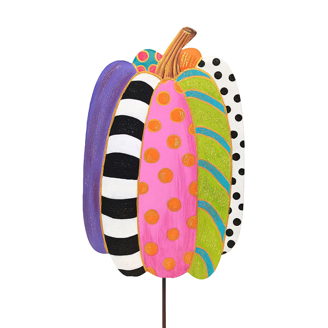 Colorful pumpkin-shaped decorative stake with polka dot, striped, and solid patterns on a white background.