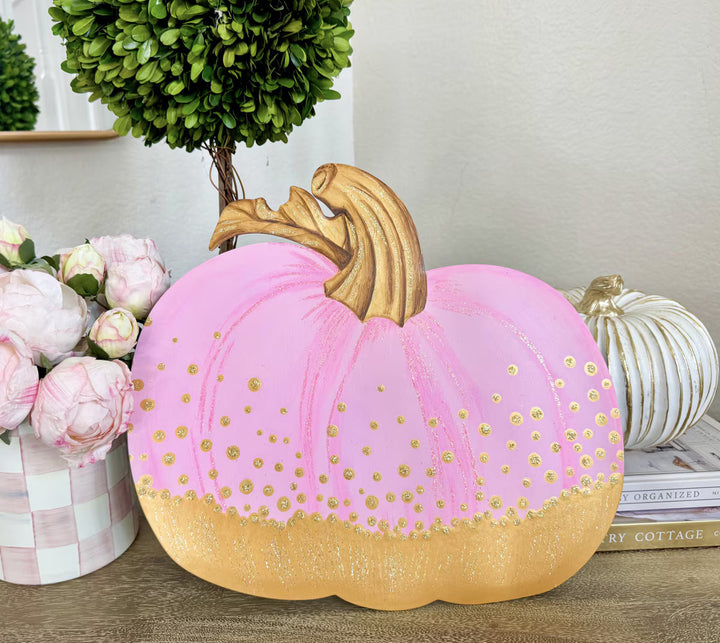 Round Top Collection Pink and Gold Pumpkin with soft pink finish, glittery gold bottom and sculptural gold stem displayed indoors.