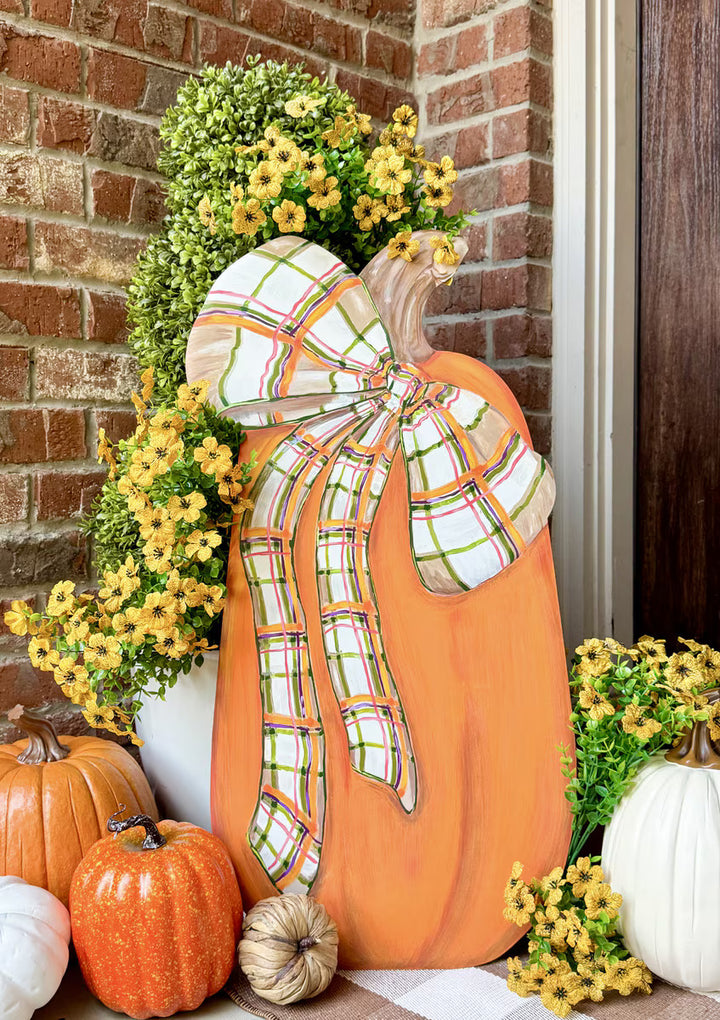 Large Modern Plaid Pumpkin by The Round Top Collection with oversized plaid bow styled with orange and white pumpkins on a fall porch.