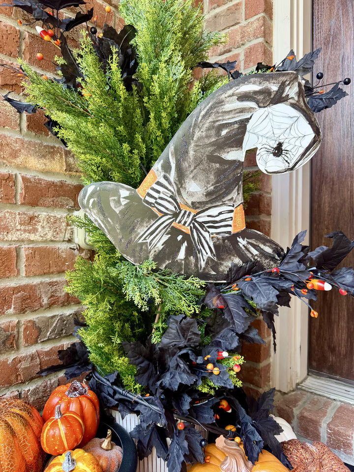 Spooky Black Witch Hat metal Halloween garden stake by The Round Top Collection featuring a striped bow, spiderweb, and whimsical Halloween details.