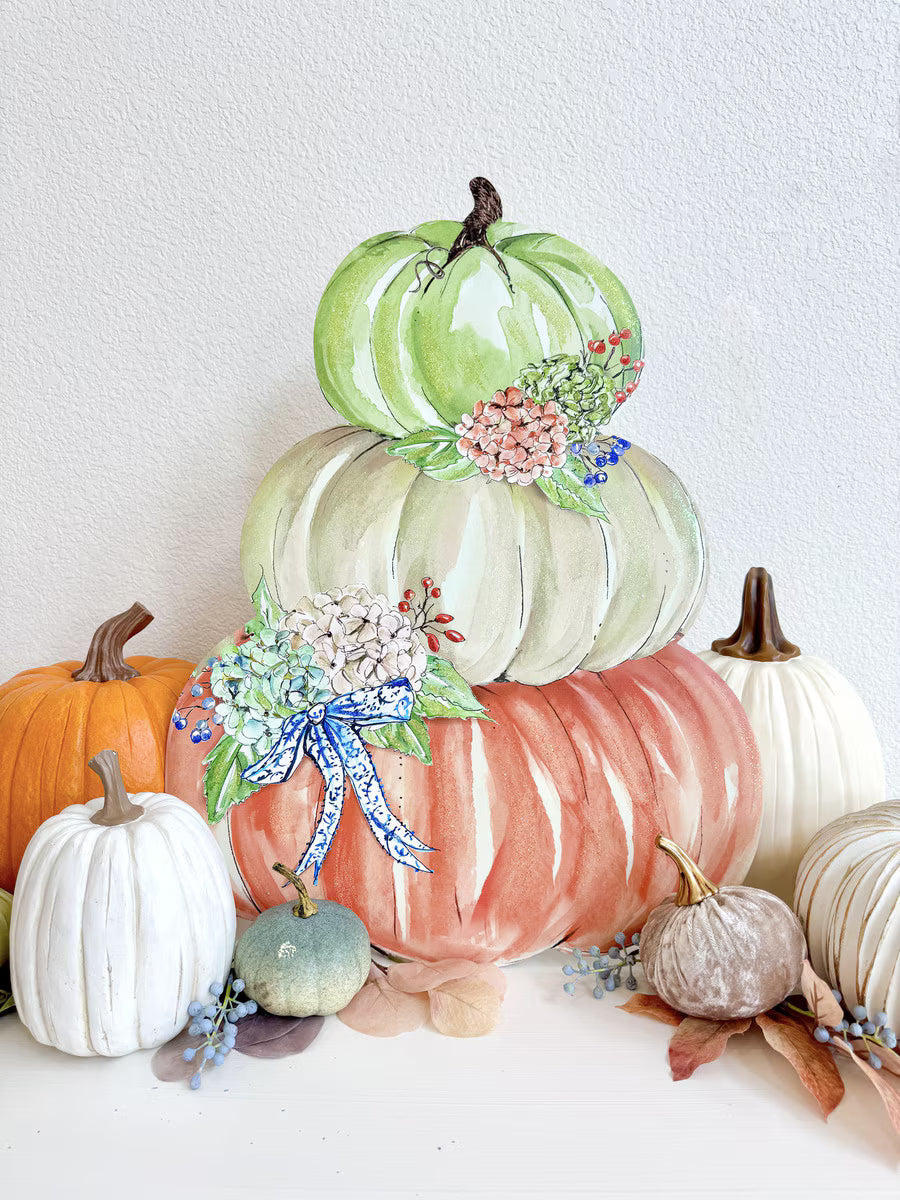 Autumn Feast Pumpkin Stack by Rosanne Beck featuring sage, neutral and coral pumpkins with hydrangeas and blue bow styled with fall décor.