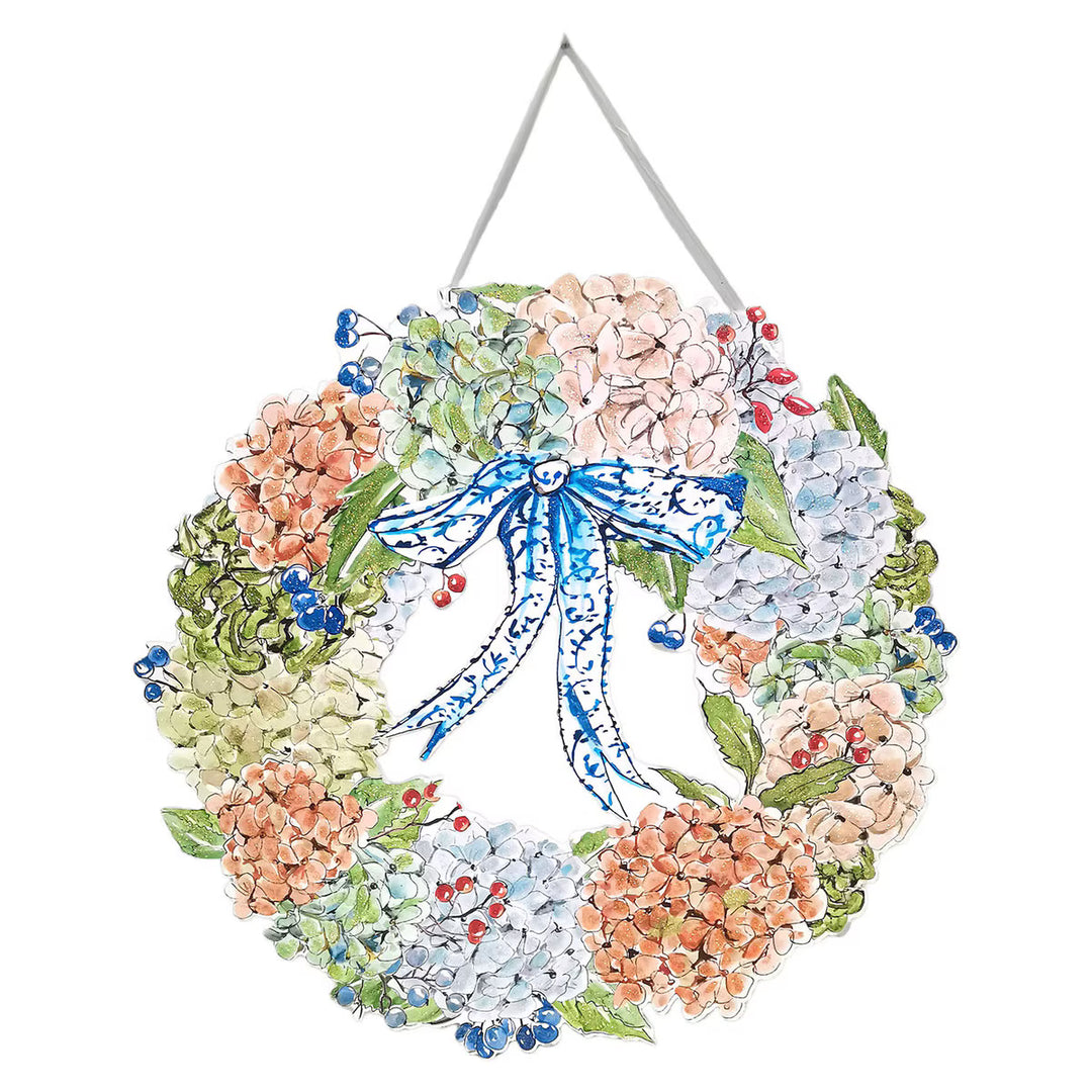 Autumn Hydrangea recycled PVC door hanger by Rosanne Beck featuring sage, blue, blush and peach hydrangeas with a blue-and-white bow and glitter accents.