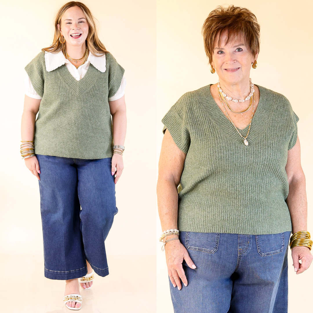 Two women wearing olive green sleeveless top and blue jeans against a plain background