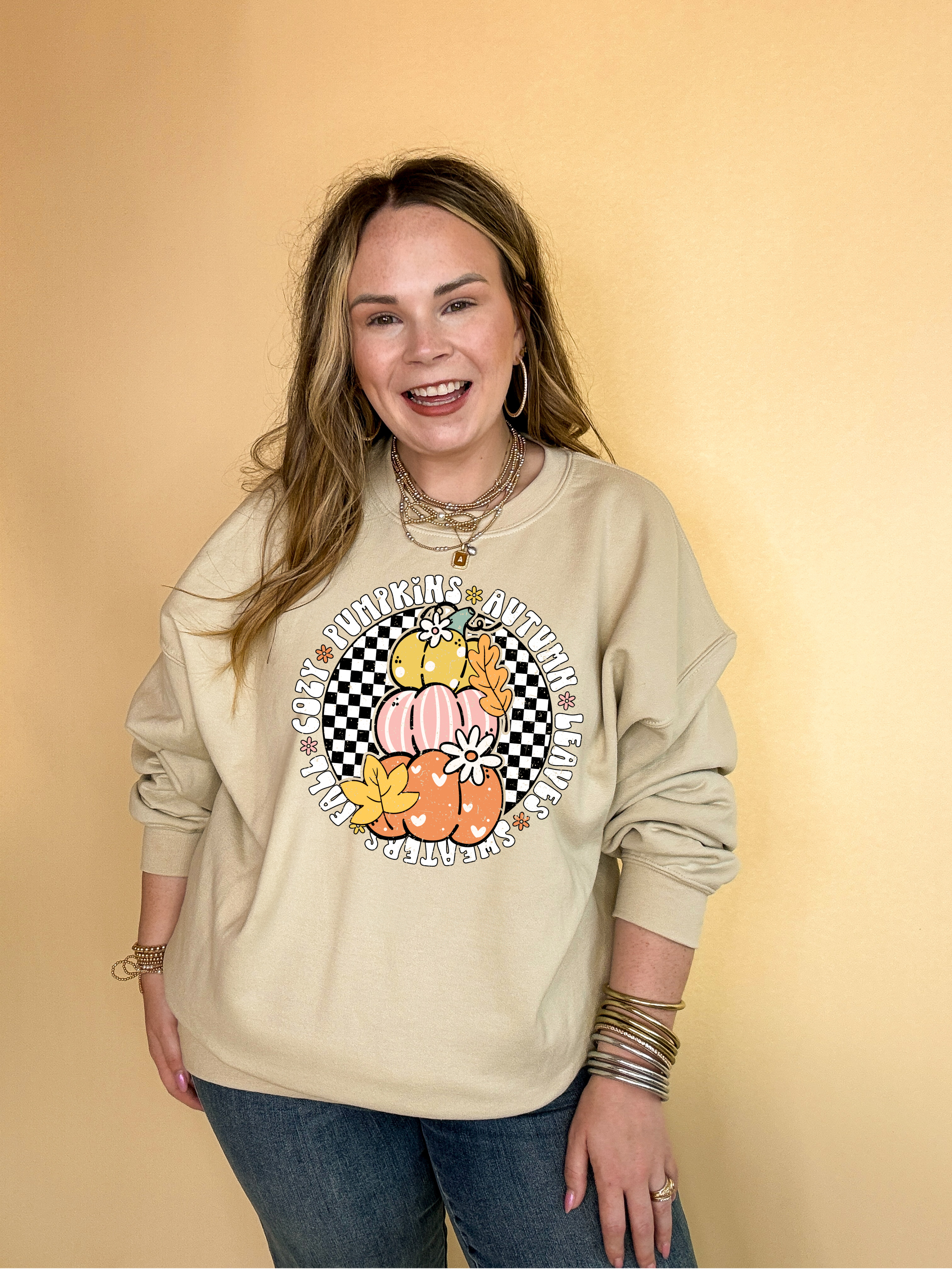 Online Exclusive | Fall Illustrations Graphic Sweatshirt with Three Pumpkins on a Checkered background in Multiple Color Options