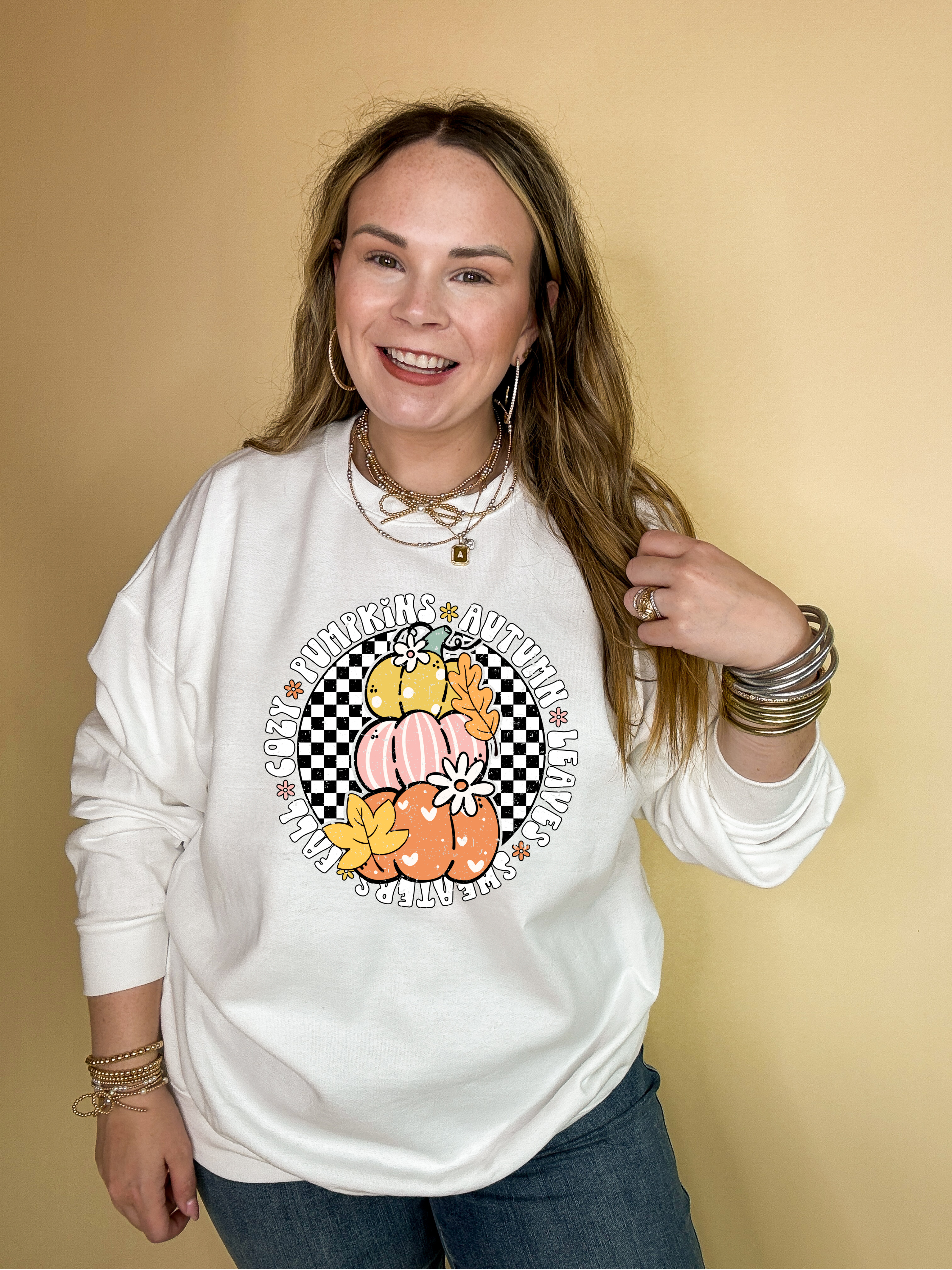 Online Exclusive | Fall Illustrations Graphic Sweatshirt with Three Pumpkins on a Checkered background in Multiple Color Options