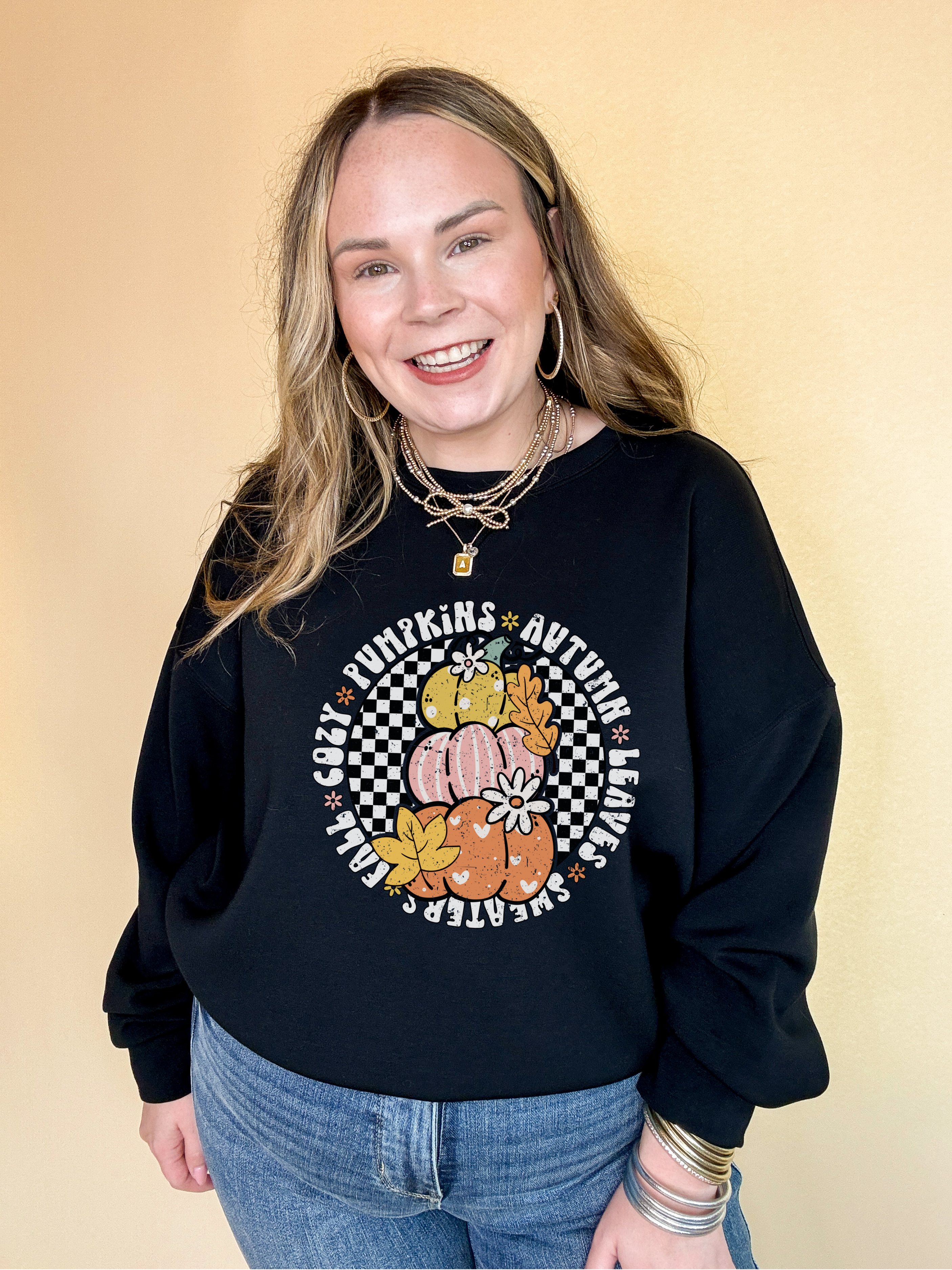 Online Exclusive | Fall Illustrations Graphic Sweatshirt with Three Pumpkins on a Checkered background in Multiple Color Options