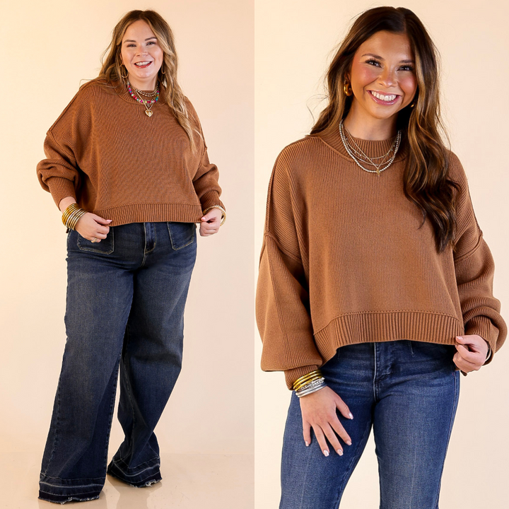 Two models wearing the Camel Brown 'Fireside Fit' cropped long sleeve mock neck sweater with jeans. Against a plain background.