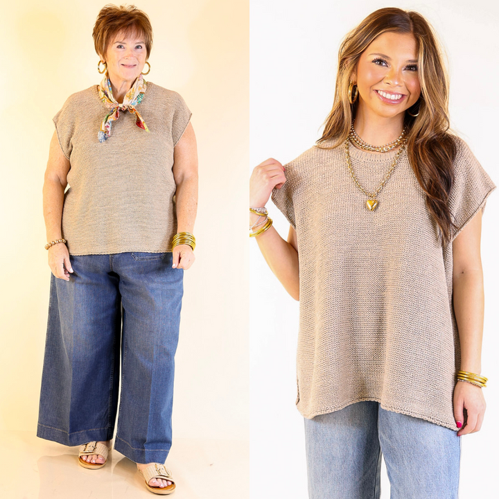 Two women wearing a beige sweater vest top and blue jeans against a plain background.