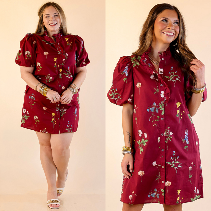 Models are wearing button up floral dress in maroon against a beige background