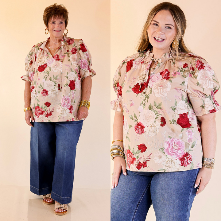 Two women wearing beige floral tops and blue jeans on a beige background