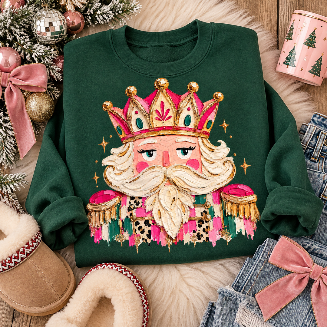 Gem Classic Nutcracker Christmas graphic tee or sweatshirt on forest green with a jeweled pink and gold nutcracker with a crown