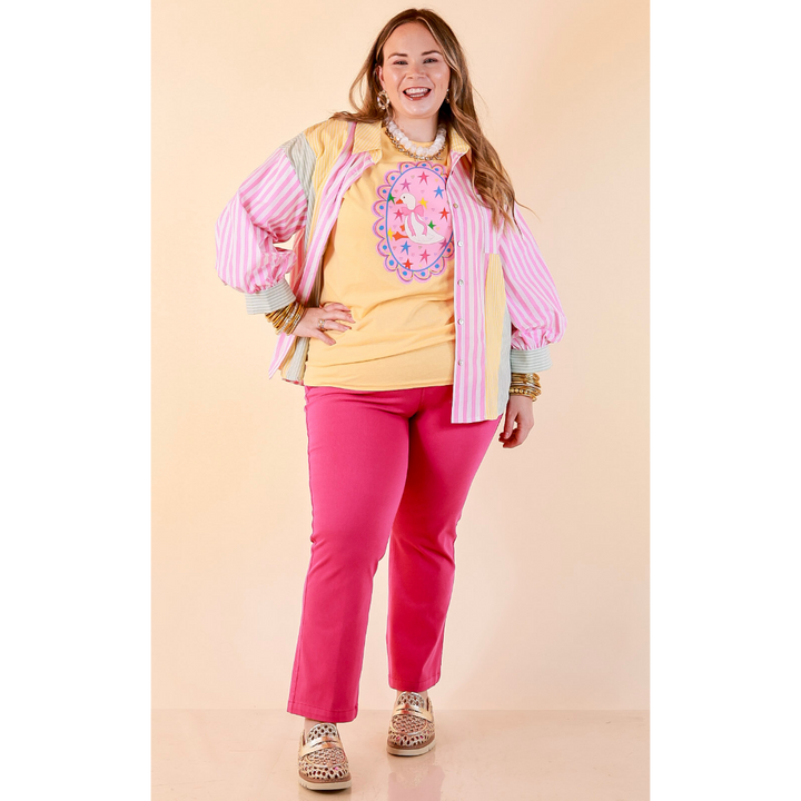 Goose on the Loose Whimsical Pink Background with Stars and Hearts Goose Printed Graphic Tee in Butter Yellow