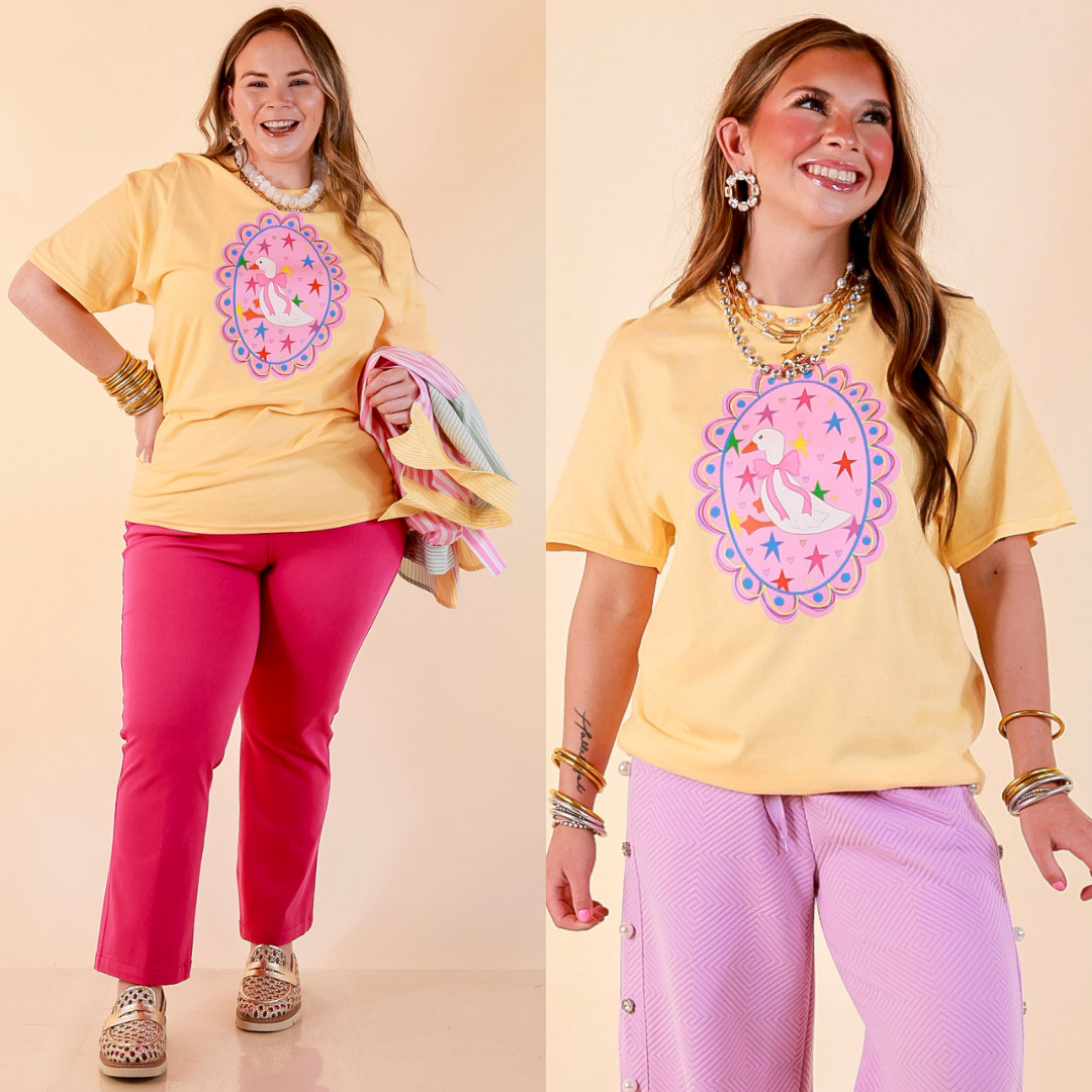 Goose on the Loose Whimsical Pink Background with Stars and Hearts Goose Printed Graphic Tee in Butter Yellow