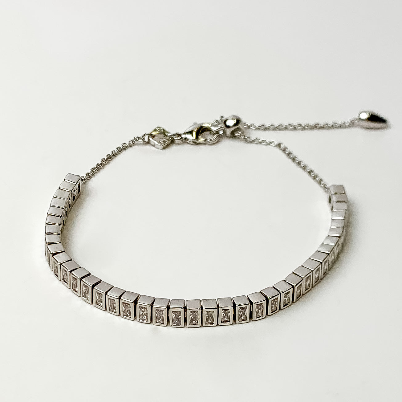 This Gracie Silver Long Tennis Delicate Chain Bracelet in White by Kendra Scott is pictured on a white background.
