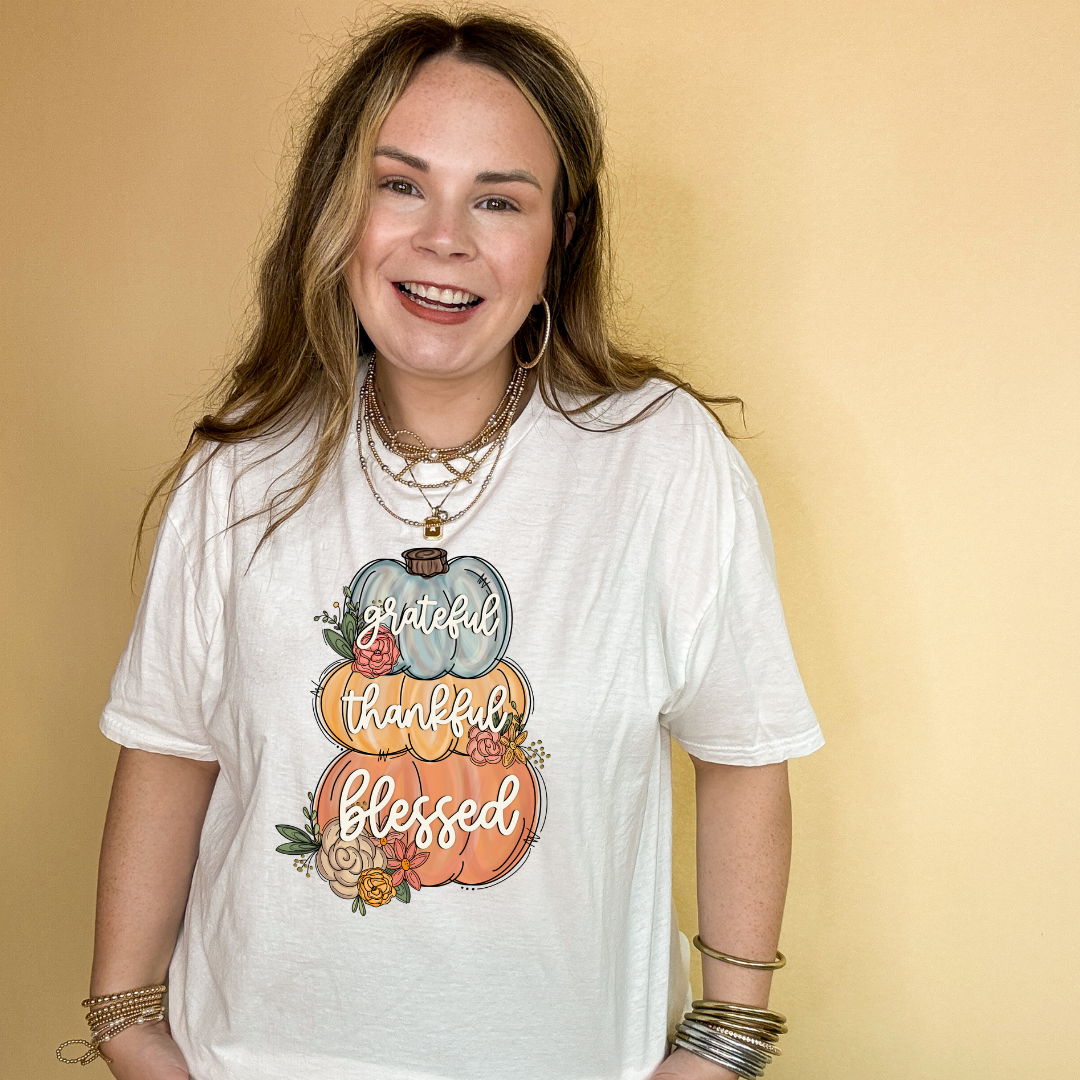 Online Exclusive | Grateful, Thankful, Blessed Stacked Pumpkins and Floral Arrangement Graphic Tee in Multiple Color Options