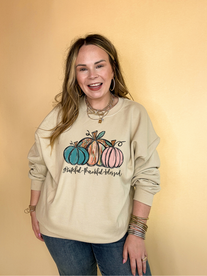 Online Exclusive | Grateful, Thankful and Blessed Three Painted Pumpkin Graphic Sweatshirt in Multiple Color Options