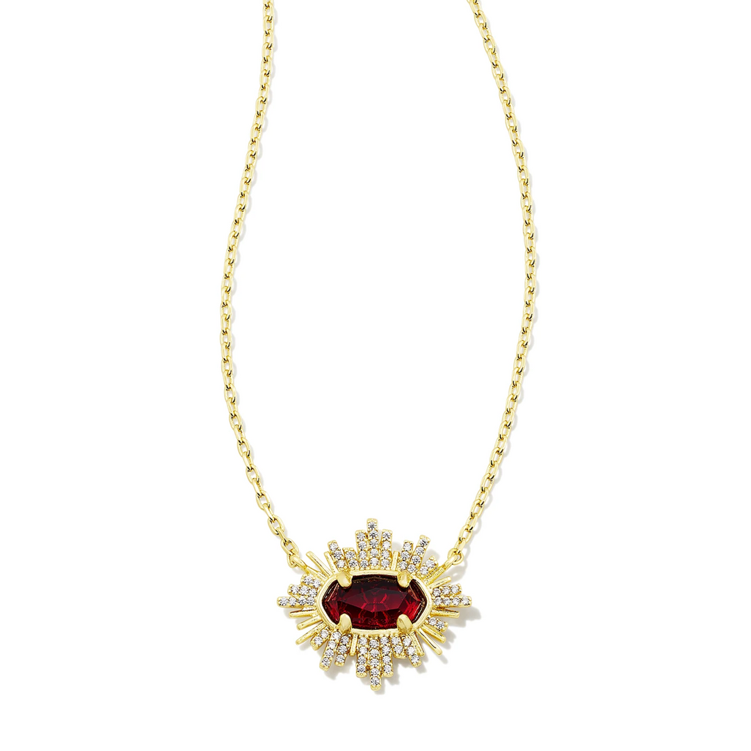 This Grayson Sunburst Gold Frame Pendent in Red Glass by Kendra Scott is pictured on a white background.