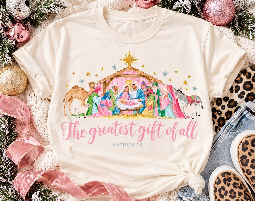 Greatest Gift Colorful Christmas graphic tee or sweatshirt on ivory with a watercolor nativity scene with The Greatest Gift of All script
