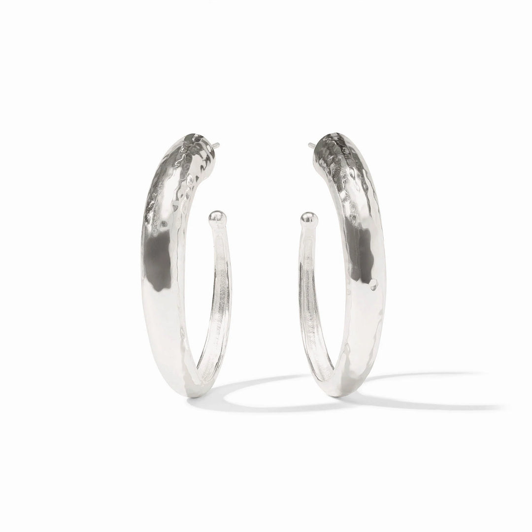 Pair of silver hoop earrings on a white background