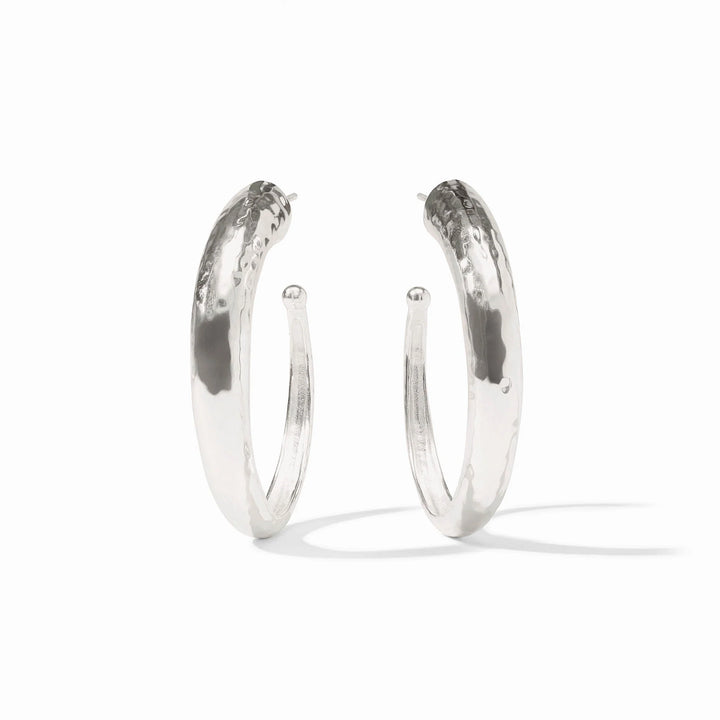 Pair of silver hoop earrings on a white background