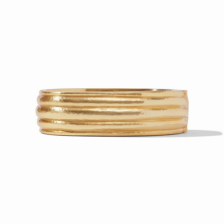 Gold bangle on a white background