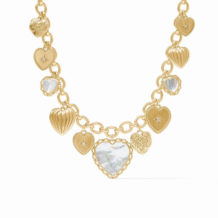 Gold necklace with heart-shaped charms on a white background
