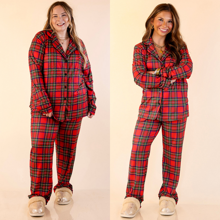 Two women wearing Tartan Plaid Matching PJ Set with Black Trim in Red Plaid on a beige background