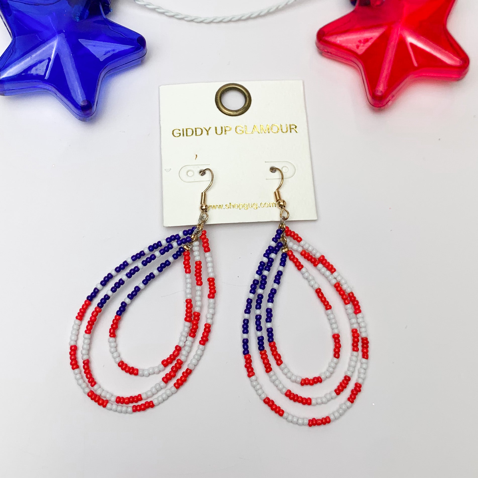 Red, White, and Beads USA Open Teardrop Earrings. Pictured on a white background with a red and blue star above the earrings for decoration.