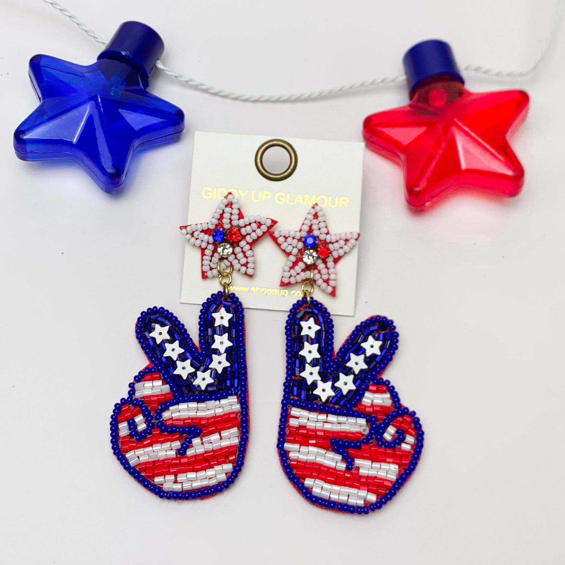 Peace Sign Beaded USA Themed Earrings. Pictured on a white background with a red and blue star above for decoration.
