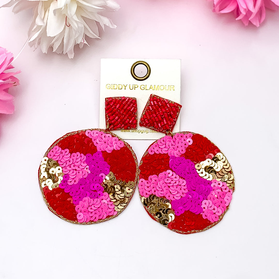 Diamond Post Back with Circle Drop Beaded Earrings in Pink Mix. Pictured on a white background with pink and white flowers around the earrings.